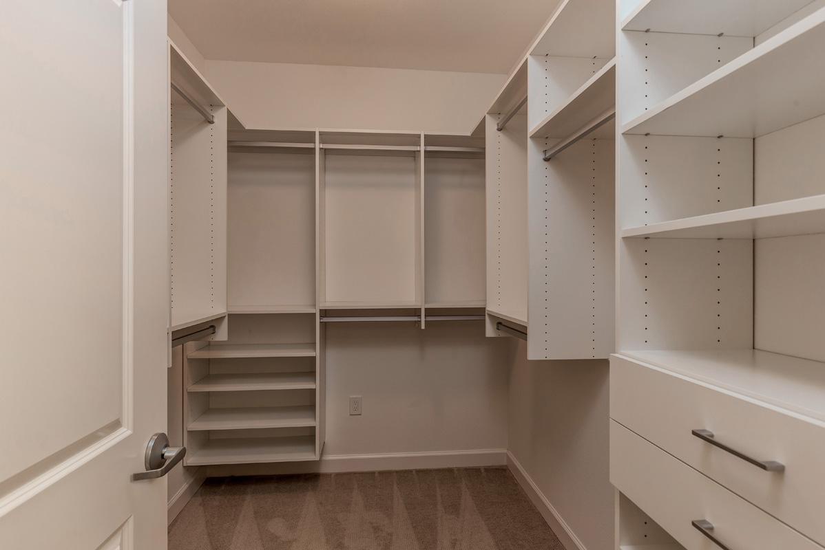 Saratoga Retirement Community Via Grande Walk-in closet with a variety of shelves and drawers