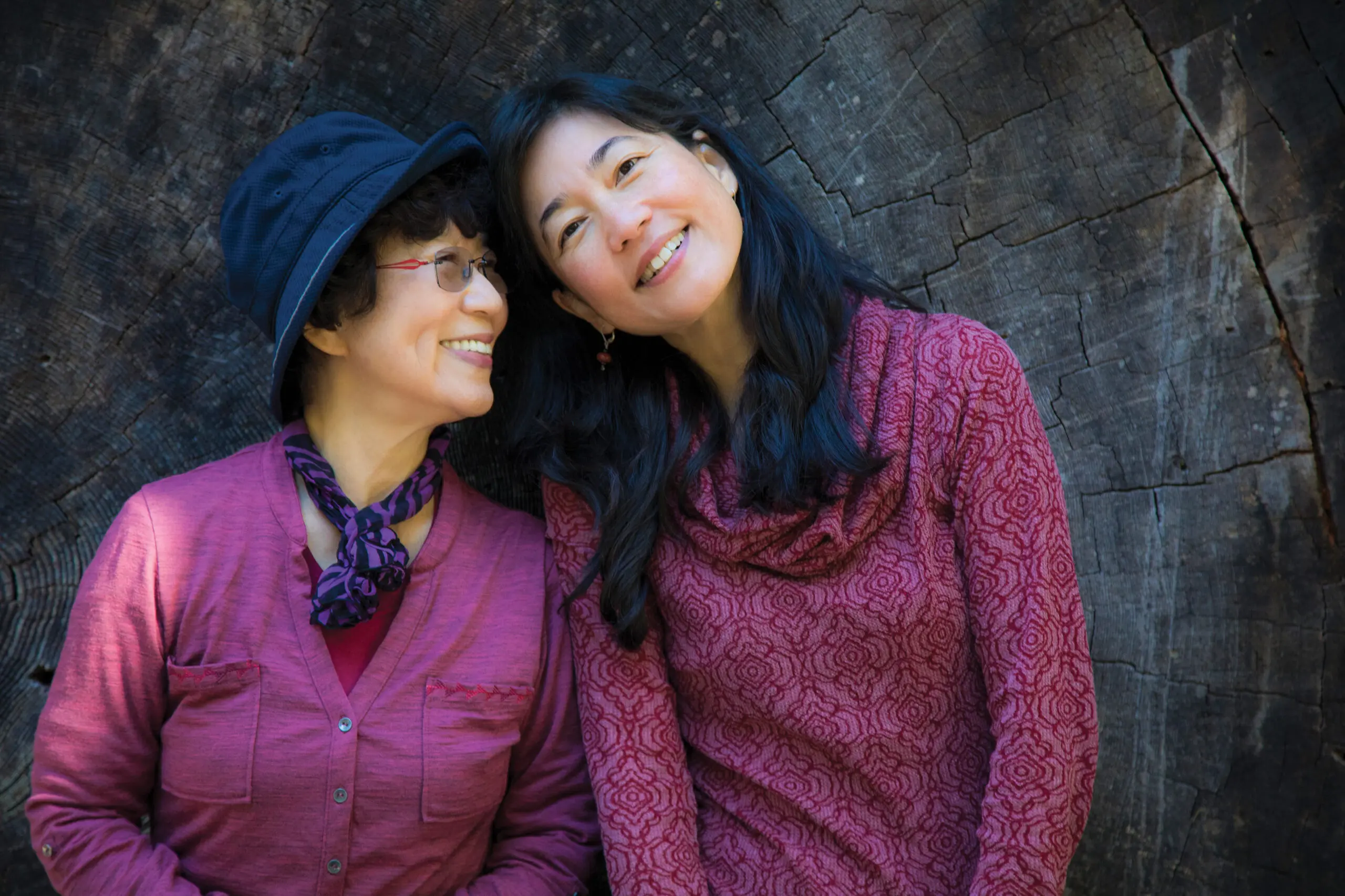 Older woman smiles with adult daughter